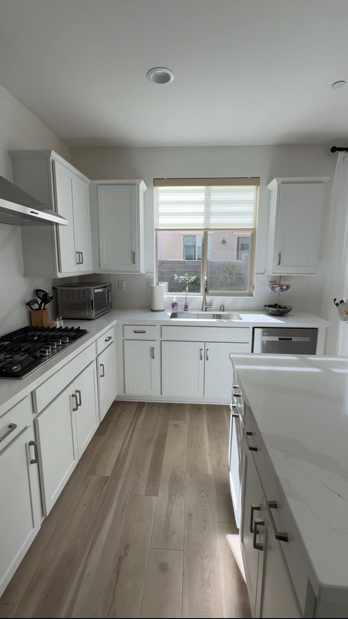 Airbnb kitchen with white cabinets