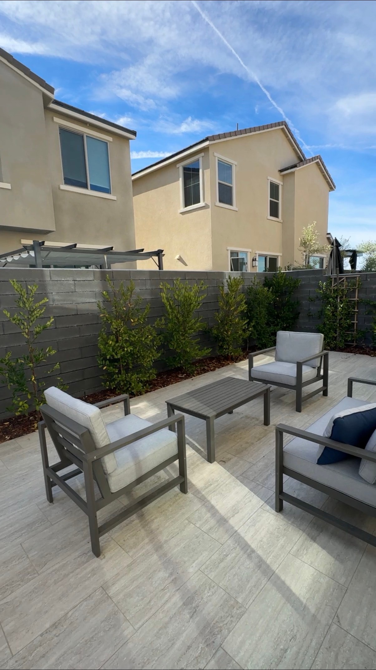 Airbnb backyard patio with outdoor furniture